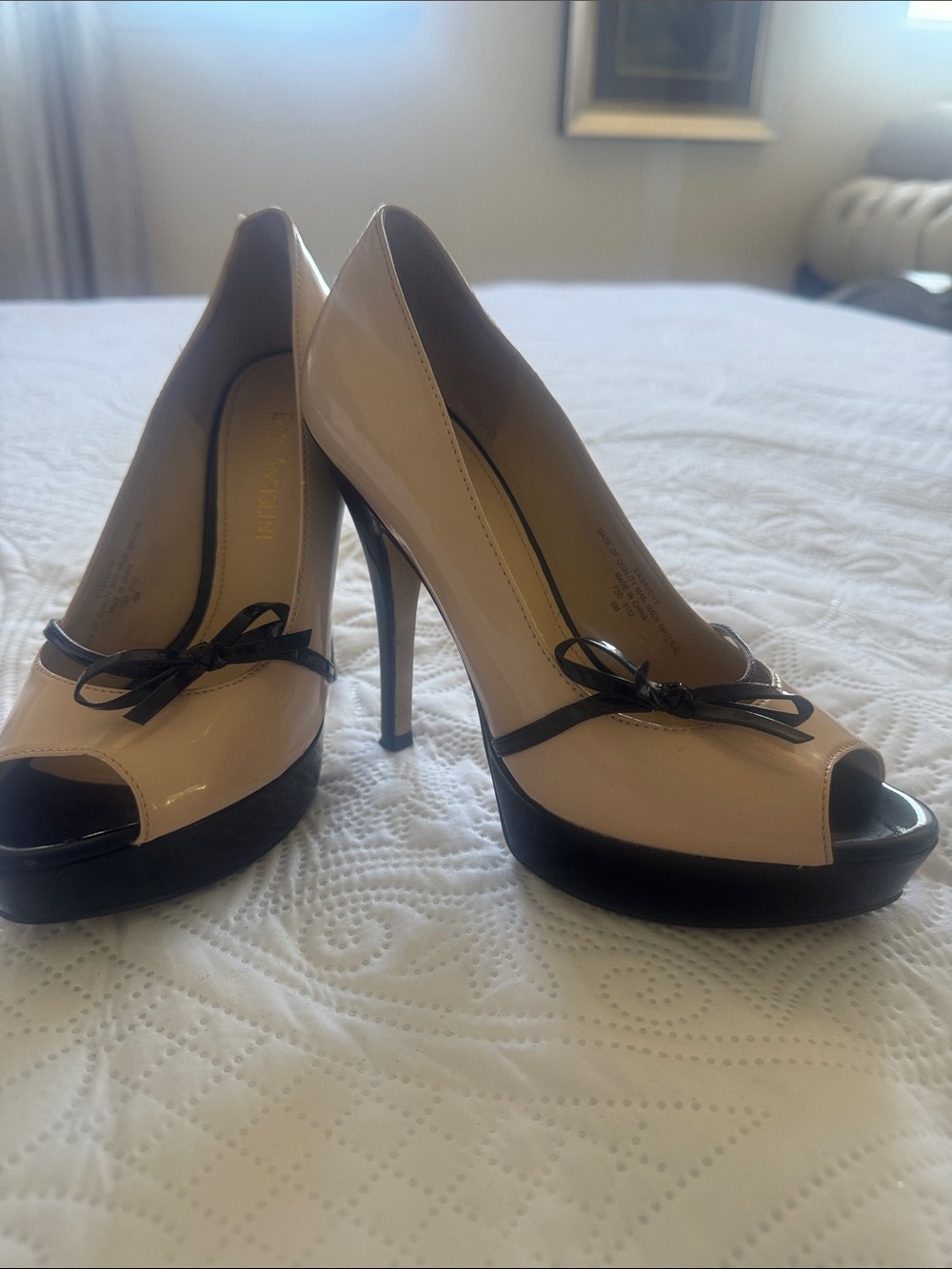 Enzo Angiolini Nude Patent Peep-Toe Heels with Black Trim and Bow Accent